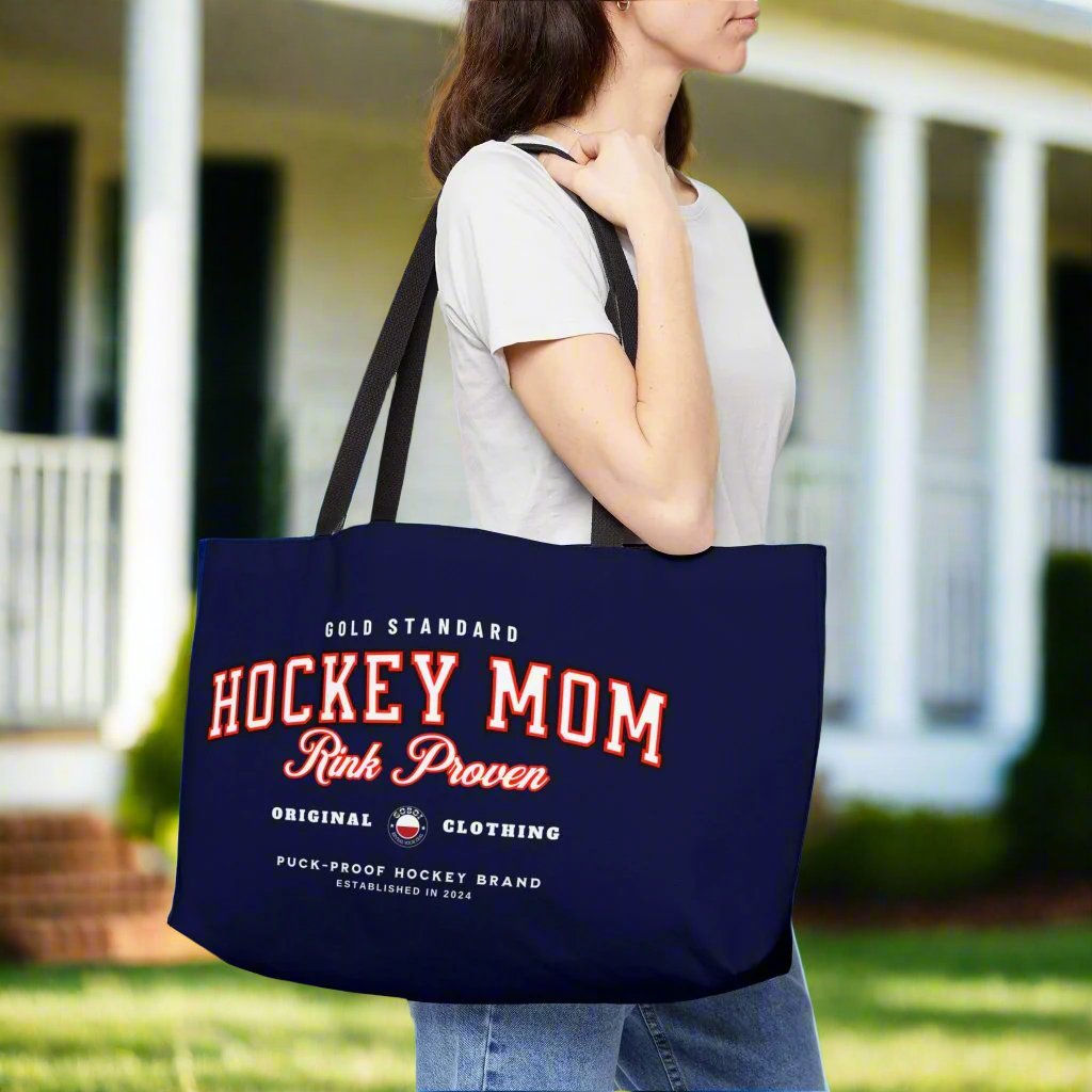 Rink Proven Hockey Mom weekender - GoBoi Store - Hockey Mom weekender tote bag is perfect for those who need to bring along a little bit of everything but prefer to travel light. The classic design pairs beautifully with any outfit, whether you're heading to the rink, a shopping spree, or the beach. This lightweight yet durable tote is spacious enough to easily fit a fleece blanket and all your rink-day essentials. Black interior lining, black handles T-bottom construction Assembled in the USA