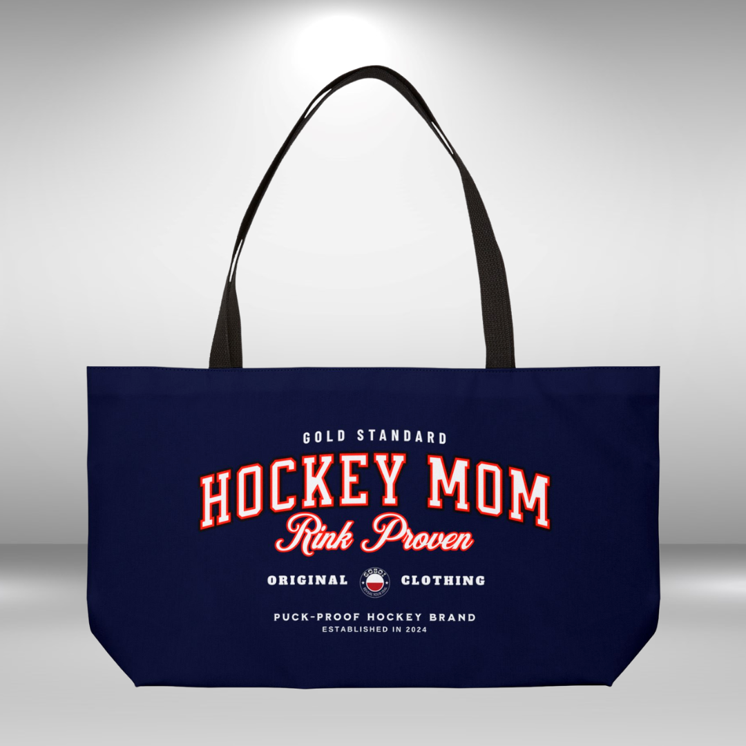 Rink Proven Hockey Mom weekender - GoBoi Store - Hockey Mom weekender tote bag is perfect for those who need to bring along a little bit of everything but prefer to travel light. The classic design pairs beautifully with any outfit, whether you're heading to the rink, a shopping spree, or the beach. This lightweight yet durable tote is spacious enough to easily fit a fleece blanket and all your rink-day essentials. Black interior lining, black handles T-bottom construction Assembled in the USA