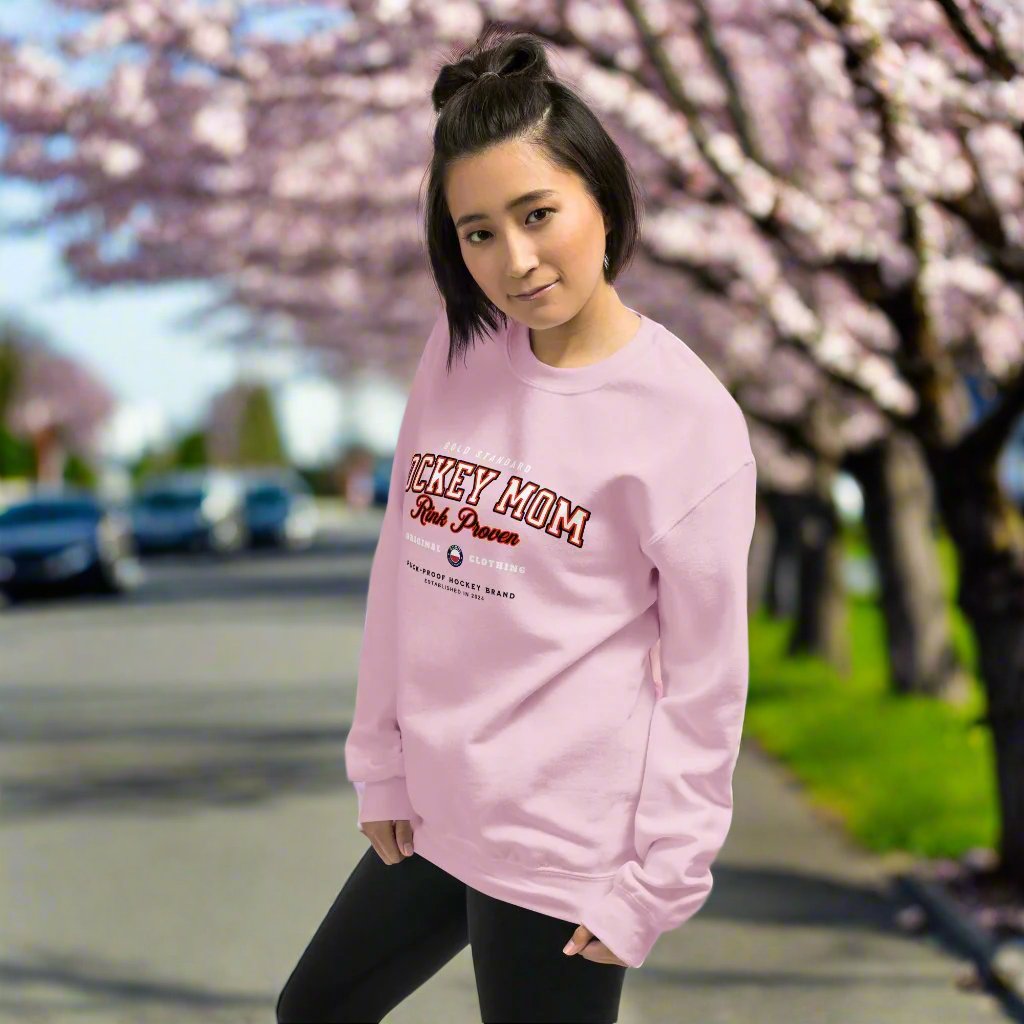 Rink Proven Hockey Mom Sweatshirt - GoBoi Store - For the moms who’ve seen it all—early mornings, rink-side cheers, and endless gear hauls. This classic varsity-style sweater shows you’re not just any hockey mom; you’re rink proven. Wear it with pride!A sturdy and warm sweatshirt bound to keep you warm in the colder months. A pre-shrunk, classic fit sweater that’s made with air-jet spun yarn for a soft feel.