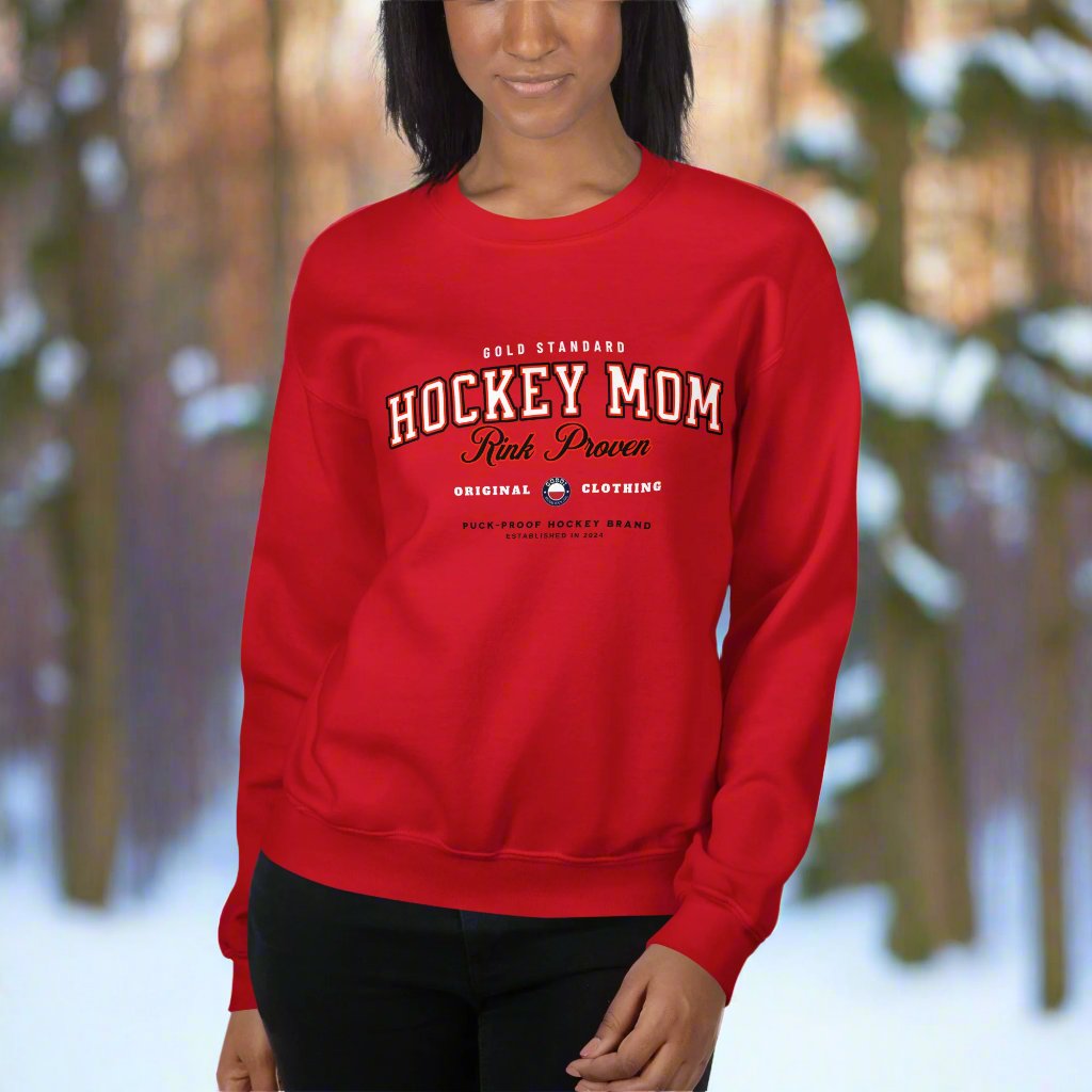 Rink Proven Hockey Mom Sweatshirt - GoBoi Store - For the moms who’ve seen it all—early mornings, rink-side cheers, and endless gear hauls. This classic varsity-style sweater shows you’re not just any hockey mom; you’re rink proven. Wear it with pride!A sturdy and warm sweatshirt bound to keep you warm in the colder months. A pre-shrunk, classic fit sweater that’s made with air-jet spun yarn for a soft feel.
