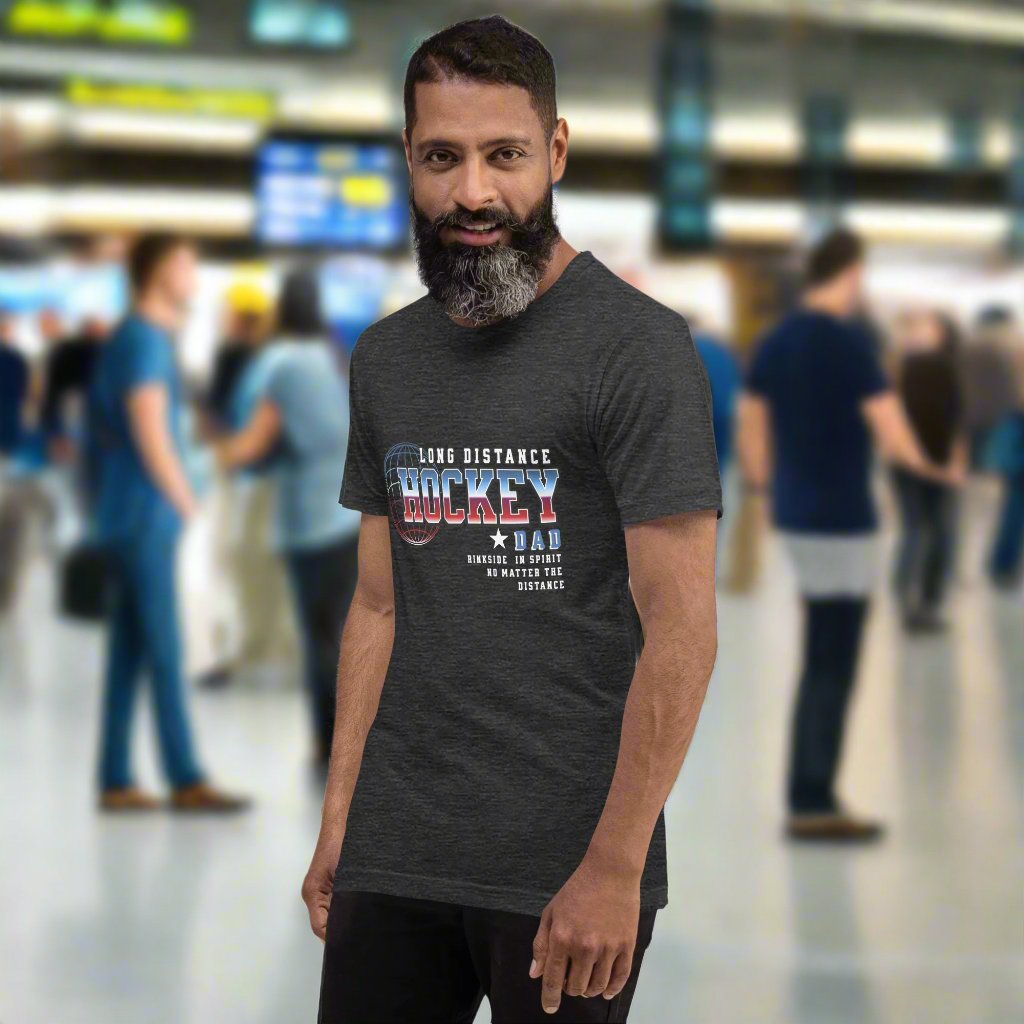 Long Distance Hockey Dad tee - GoBoi Store - Show your support with this heartfelt tee! For the proud dad who cheers from afar, it captures the essence of being rinkside in spirit, no matter the distance. Celebrate the journey as your player chases their dreams, knowing you’re always with them in heart! This t-shirt is everything you've dreamed of and more. It feels soft and lightweight, with the right amount of stretch. It's comfortable and flattering for all.