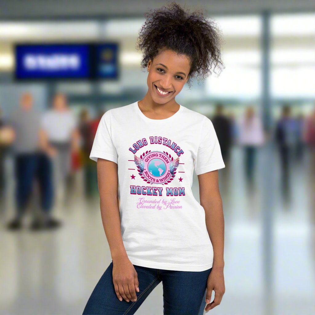 Long Distance Hockey Mom tee - GoBoi Store - Designed for the proud mom whose player is chasing dreams far from home, it symbolizes giving them roots and wings. Celebrate your unbreakable bond and support as they soar on their hockey journey, knowing you're always cheering them on from afar! This t-shirt is everything you've dreamed of and more. It feels soft and lightweight, with the right amount of stretch. It's comfortable and flattering for all.