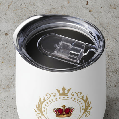 White tumbler with gold crown design and clear lid on a white background